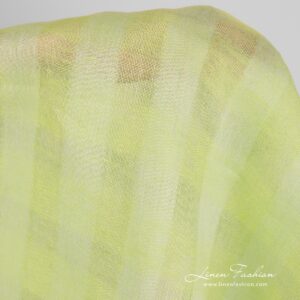 Checked linen fabric in light lime green colour.