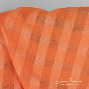 Checked linen fabric in peachy orange.