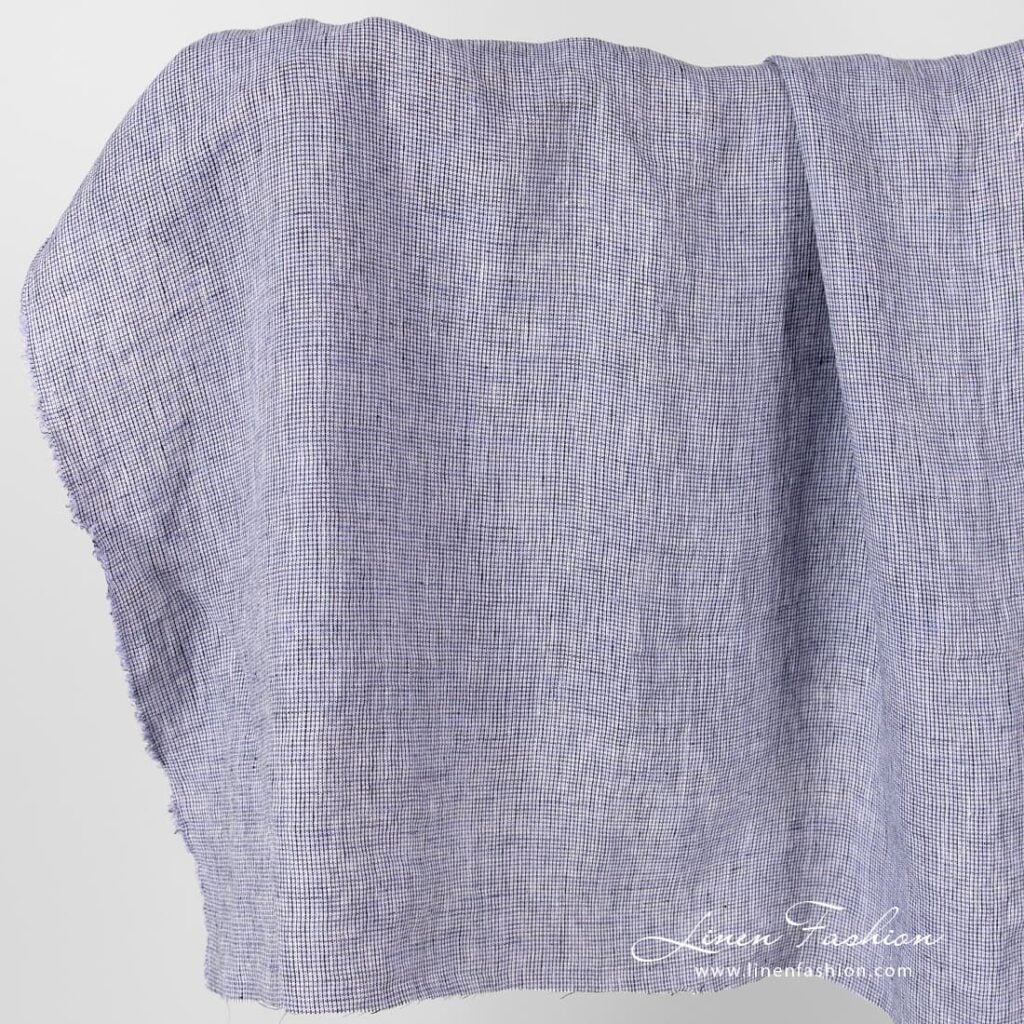 Linen fabric in black violet checks, washed.