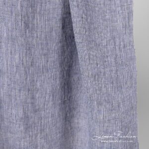 Washed 100% linen fabric in black violet checks.