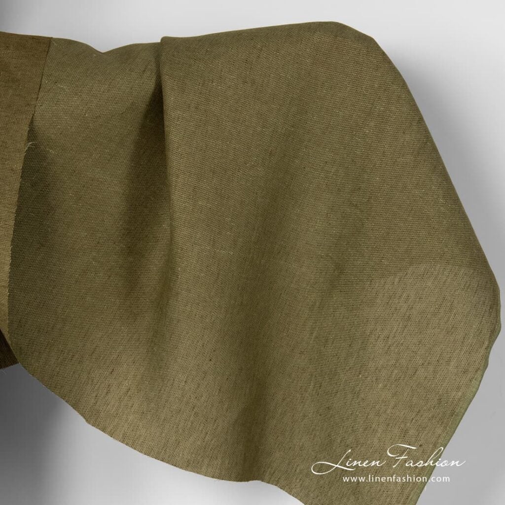 Moss green linen fabric in diagonal pattern.