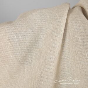 Patterned linen fabric in light sand colour.