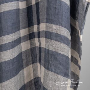 Linen fabric in stripes, woven from several shades of grey, natural linen, black and white color yarns