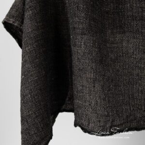 Washed 100% linen fabric in black and flax melange.
