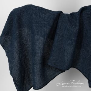 Linen fabric in navy blue melange colour, washed.