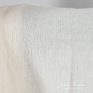 Linen fabric in off-white color, plain weave pattern