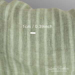 Green linen fabric in stripes, specially washed