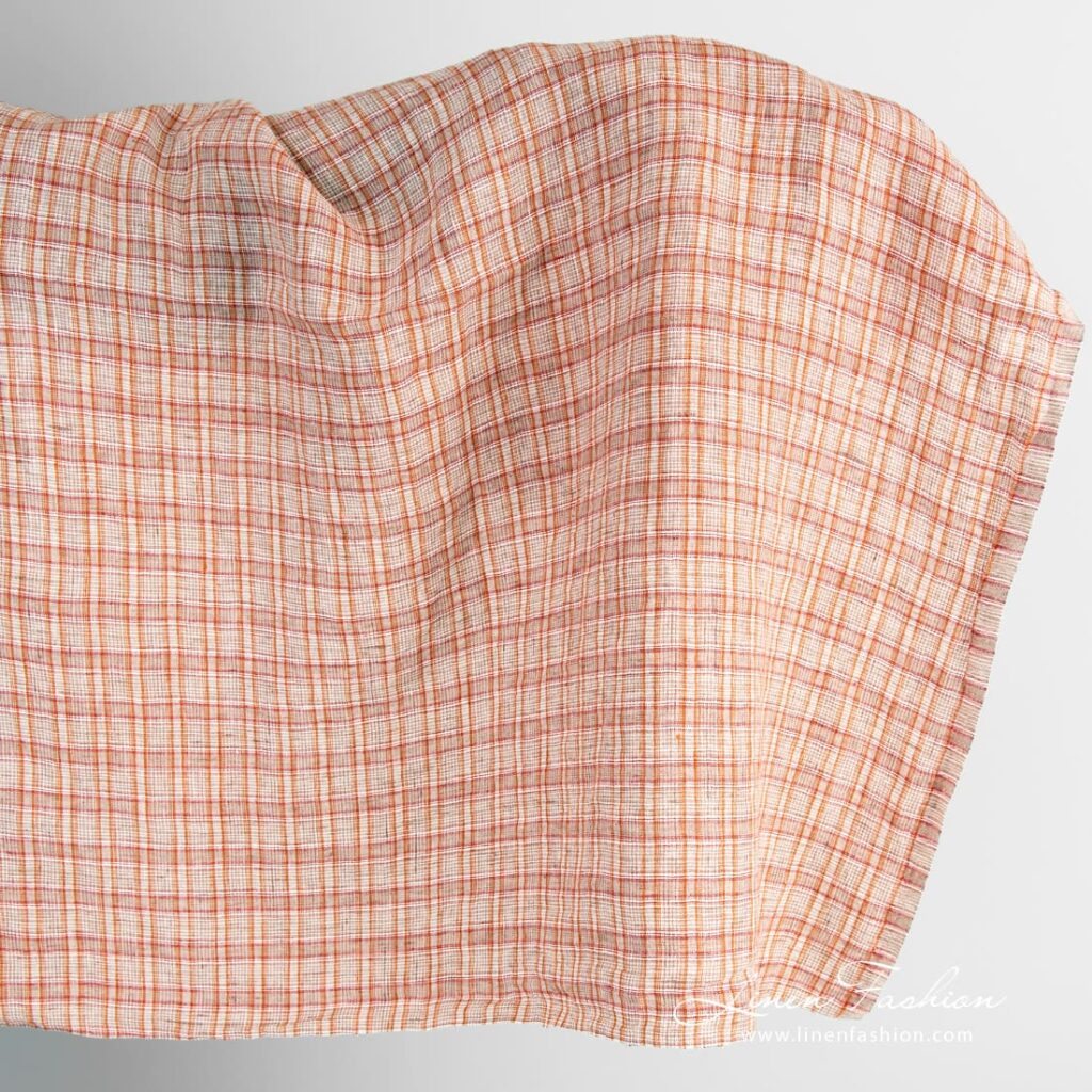 Orange linen fabric in checks, washed