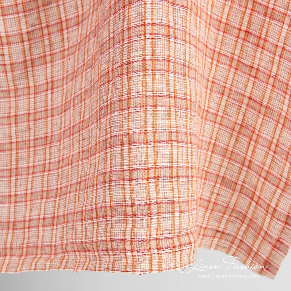 Oransje linstoff i ruter vasket 3 Orange linen fabric in checks, specially washed, for home textile and clothes