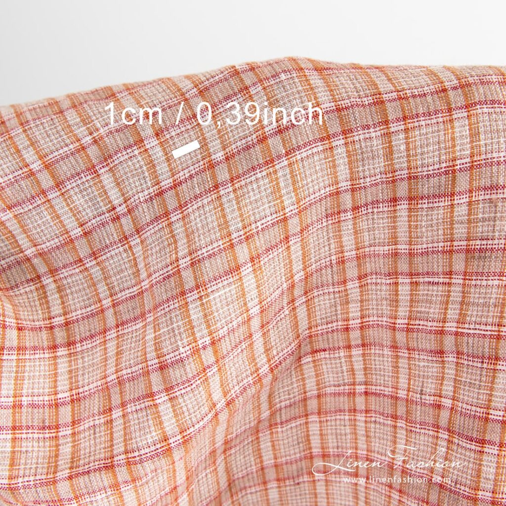 Oransje linstoff i ruter vasket 4 Checked linen fabric woven in white, orange, brown and red yarns