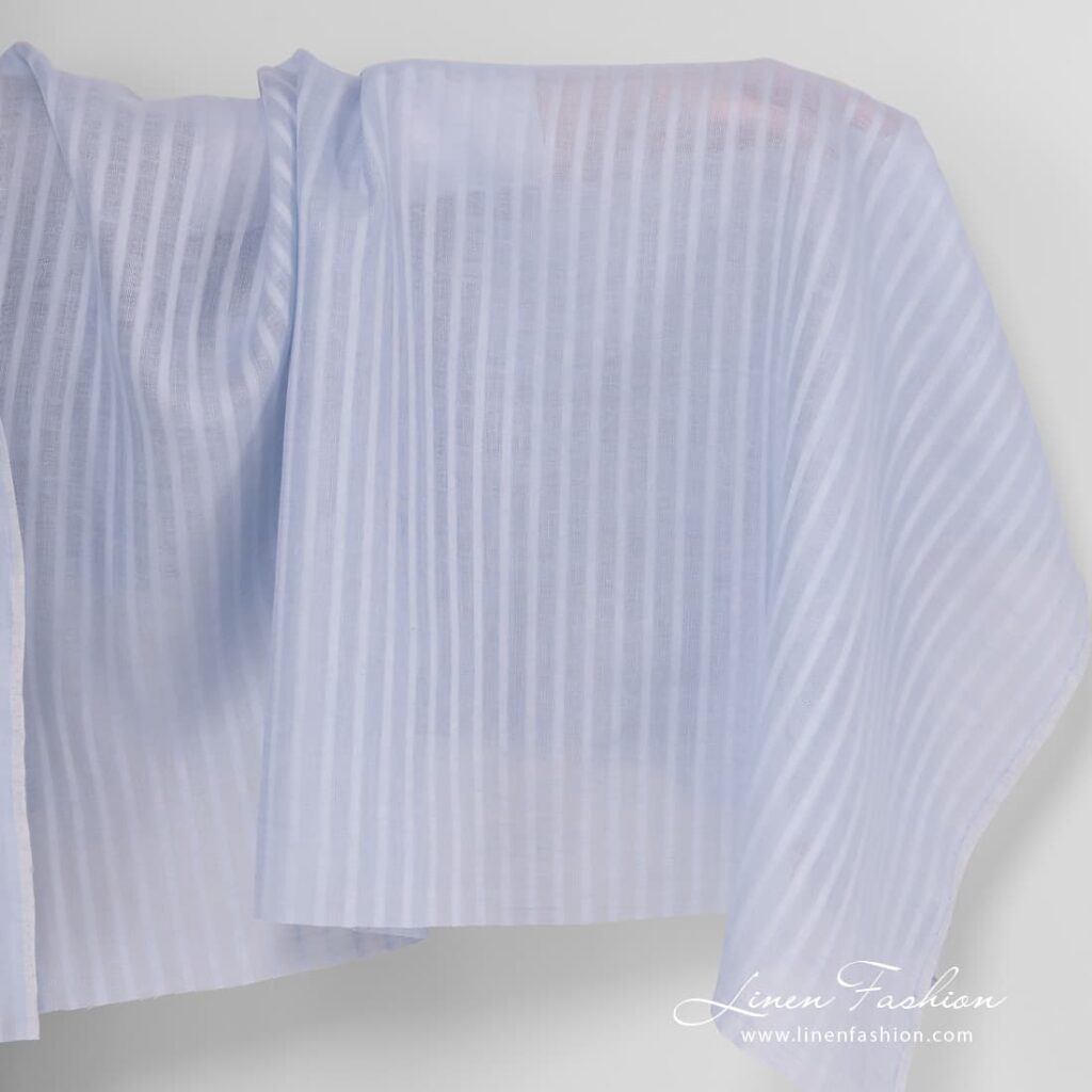 Light blue linen fabric with open weave pattern.