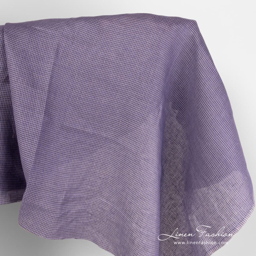Linen fabric in purple waffle weave checks.