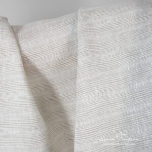 Brownish grey striped linen fabric.