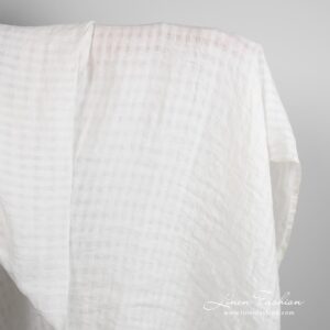 Off-white linen fabric in transparent checks