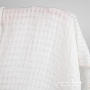 Off-white linen fabric in transparent checks, washed