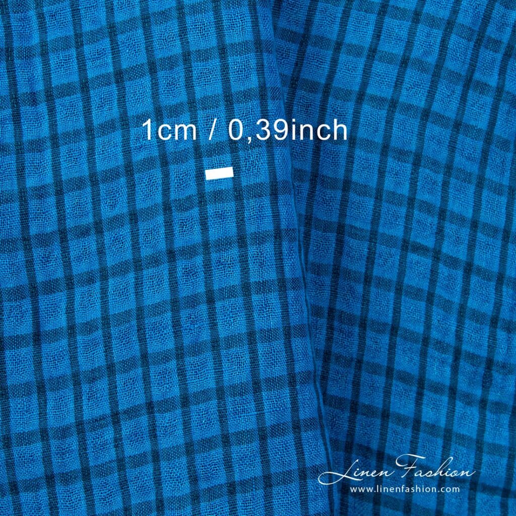 Linstoff i klare blå ruter vasket 4 Checked linen fabric woven from brilliant blue and dark turquoise yarns