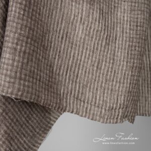 Washed 100% linen fabric in checks.