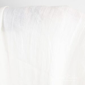 Off-white linen fabric with delicate vertical stripes