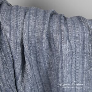 Blue grey linen fabric in vertical stripes, specially washed to increase softness