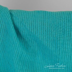 Striped linen fabric in turquoise color, specially washed to increase softness