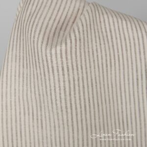 Beige 100% linen fabric in stripes.