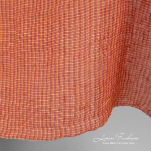 Gjennomsiktig linstoff i oransje melange vasket 11 Linen fabric in melange, woven from orange, red and yellowish yarns