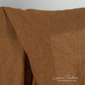 Transparent linen fabric in brown color, specially washed to increase softness