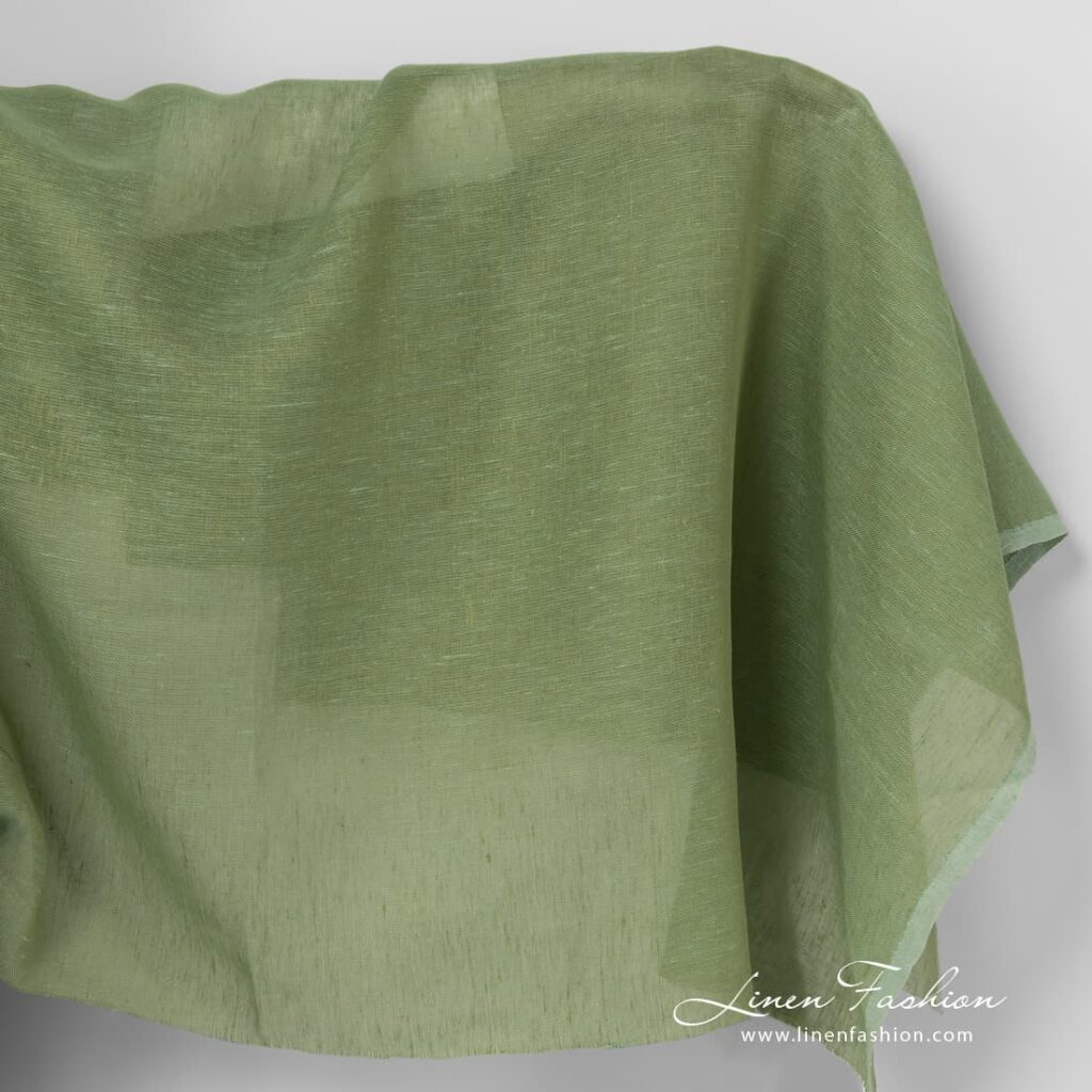 Linen fabric in apple green colour.