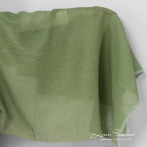 Linen fabric in apple green colour.