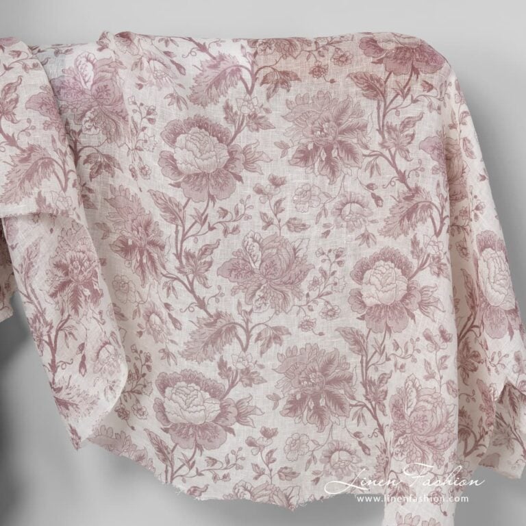 Gauzy linen fabric with printed rosy flower pattern.