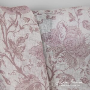 Gauzy 100% linen fabric with printed rosy flower pattern.