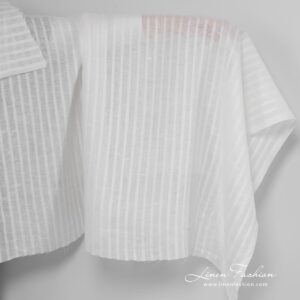 Off white linen fabric with open weave stripes.