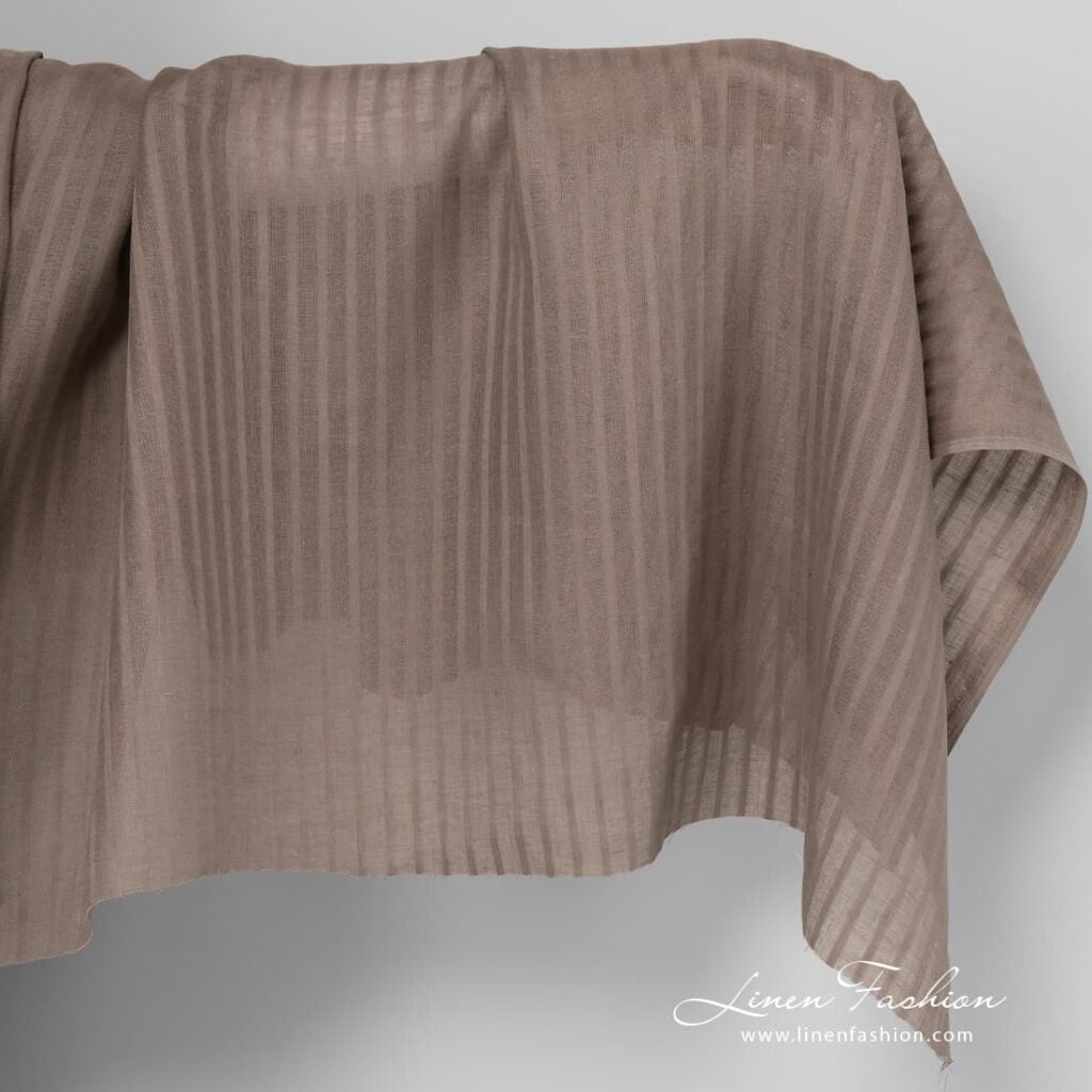 Grey linen fabric in vertical stripes.