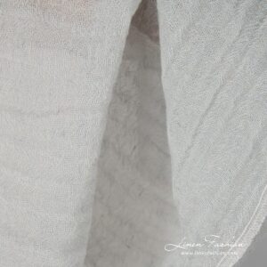 Washed pale green fabric.