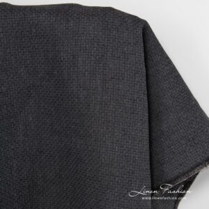 Patterned black linen fabric.