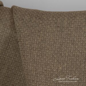 Brown dyed linen fabric with spots.