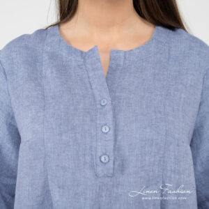 light blue linen dress with rounded neck button closure.