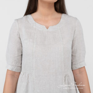 beige long linen dress with 3/4 sleeves.