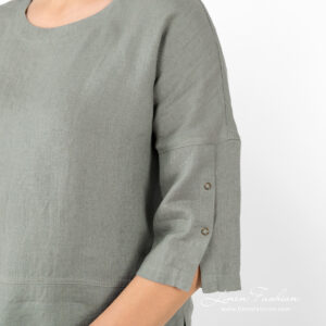 linen green blouse with sleeves with press buttons.