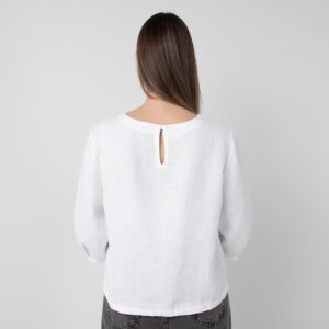 White linen blouse with pleats, button closure on back