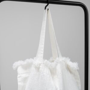 white washed linen bag with fringes